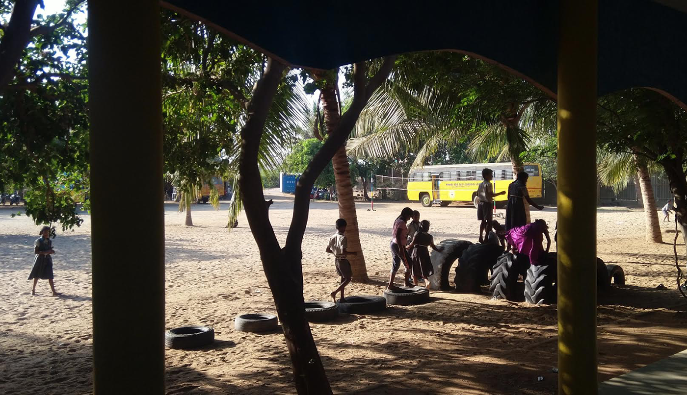Students playing with tires