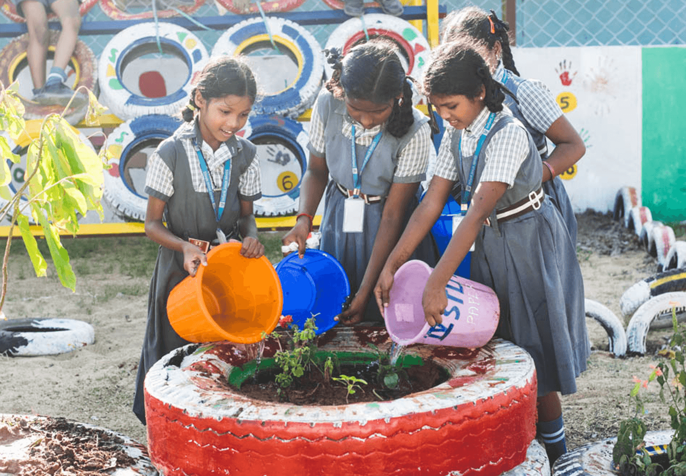 Students watering a plant